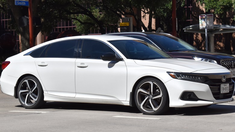 white Honda Accord Hybrid, cruising in the town
