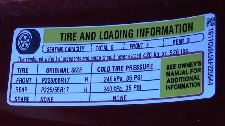 A tire information placard found in the door jamb of a car