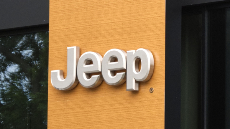 The Jeep logo on the side of a building.