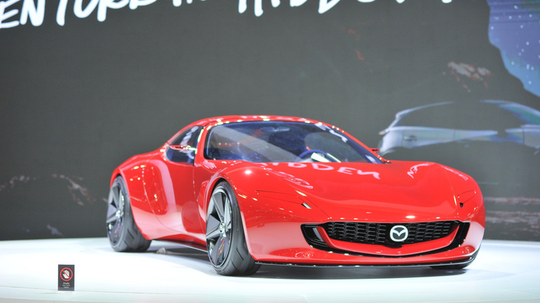 A Mazda Iconic SP concept car parked in a show room
