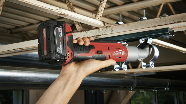 Milwaukee M18 1/4-Inch Right Angle Impact Driver being used on ceiling beam