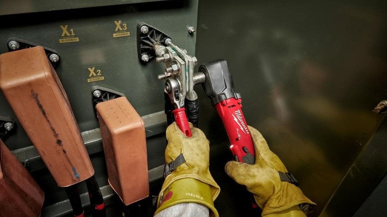 Milwaukee M12 FUEL 1/2inch Right Angle Impact Wrench being used in metal box