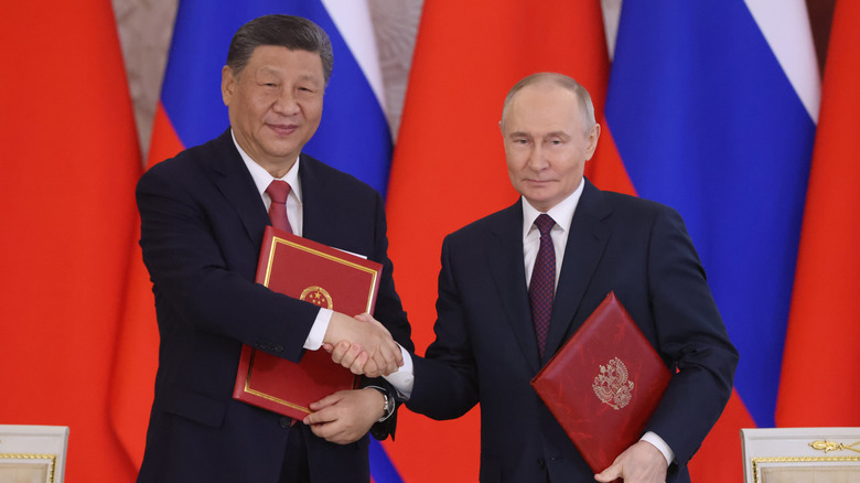 Russian President Vladimir Putin shakes hands with Chinese President Xi Jinping during a May 2025 meeting in Moscow, Russia.