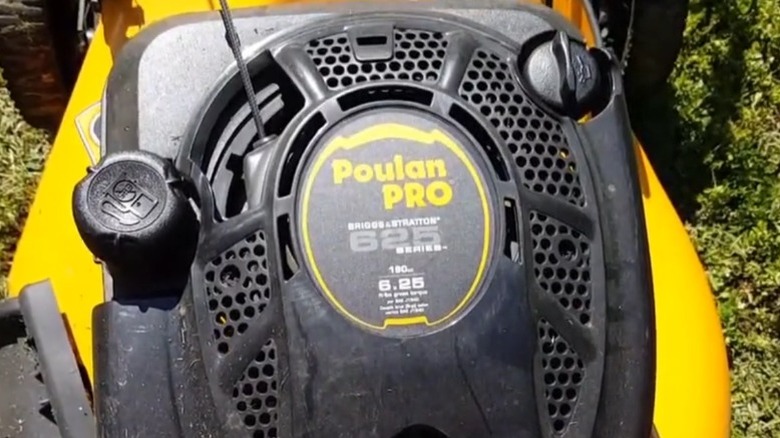 Closeup shot of the top of a Poulan Pro push lawn mower