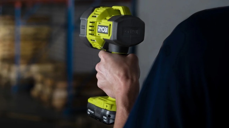 Person holding Ryobi Spotlight