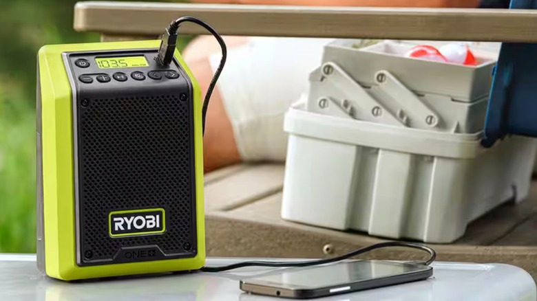 Ryobi 18V One+ Compact Bluetooth Radio/Speaker charging a phone