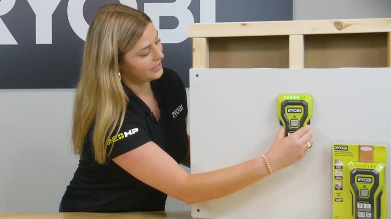 Ryobi Representative Showing The LEDs On The Ryobi Stud Finder Light Up When Over A Stud