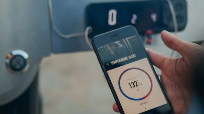 A person using Weber Connect app
