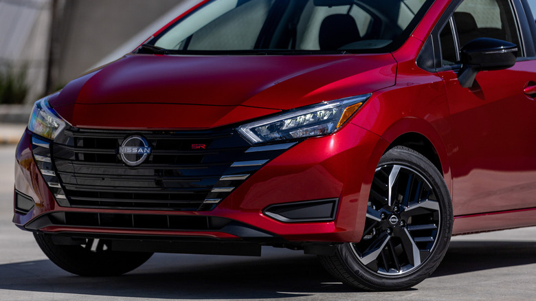 The front end of a red 2025 Nissan Versa SR