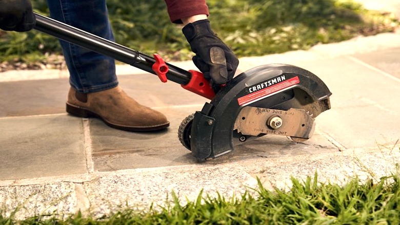 Person adjusting their Craftsman edger