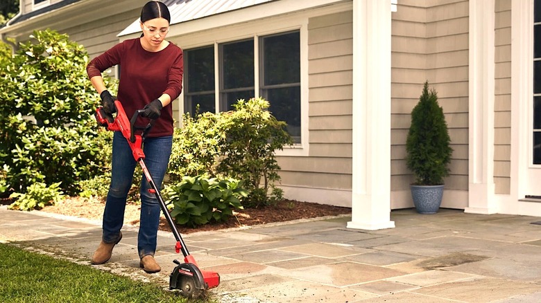 Woman using Craftsman edger on yard