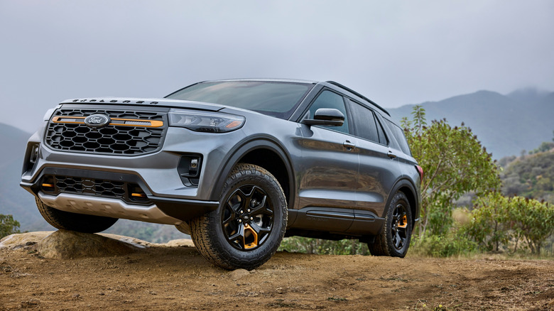 Front 3/4 view of gray Ford Explorer Tremor on mountain trail.
