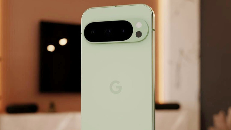 A bright green Google Pixel 10 pro in focus, with a blurry apartment background