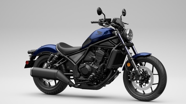 Front 3/4 shot of a dark blue 2025 Honda Rebel 1100 in studio