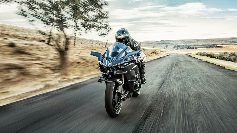 Person riding Kawasaki Ninja H2R on a desert road