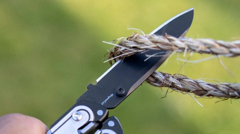 Close up of Leatherman Arc MagnaCut blade cutting rope
