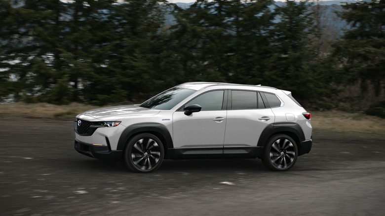 White Mazda CX-50 on a dirt road