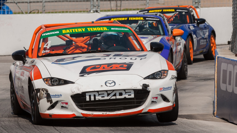 Mazda MX-5 Cup race cars on street course