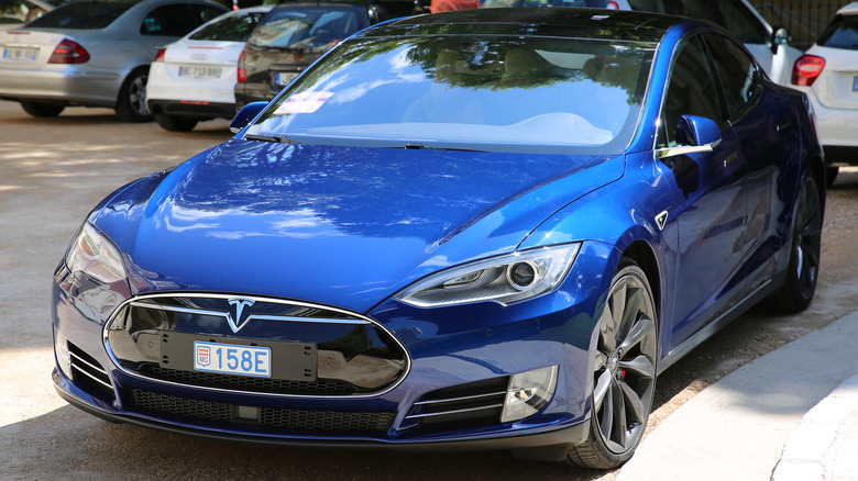 A blue Model S in a parking lot.