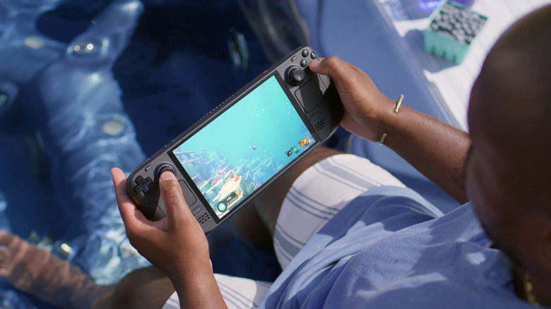 A person playing a videogame on the Steam Deck