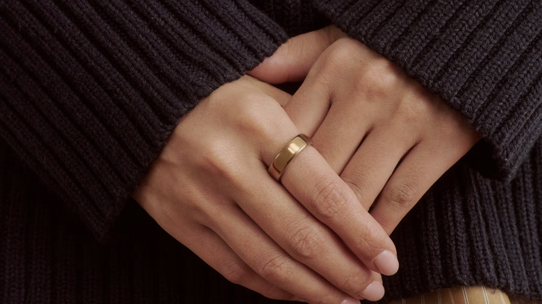 woman's hands with Oura Ring 5