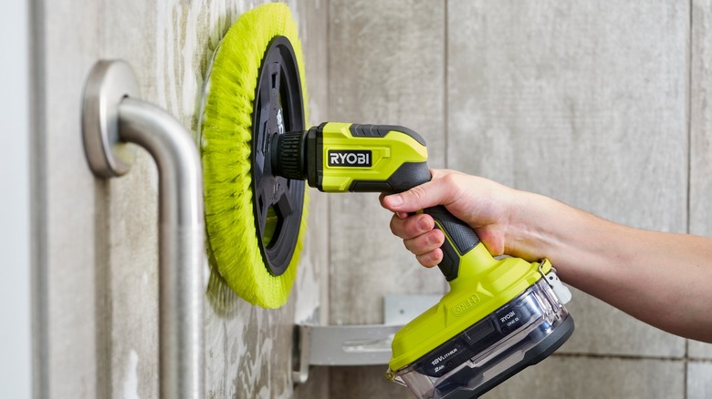Person using Ryobi Power Scrubber in shower