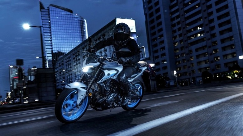The 2025 Yamaha MT-03 ridden on a city street.