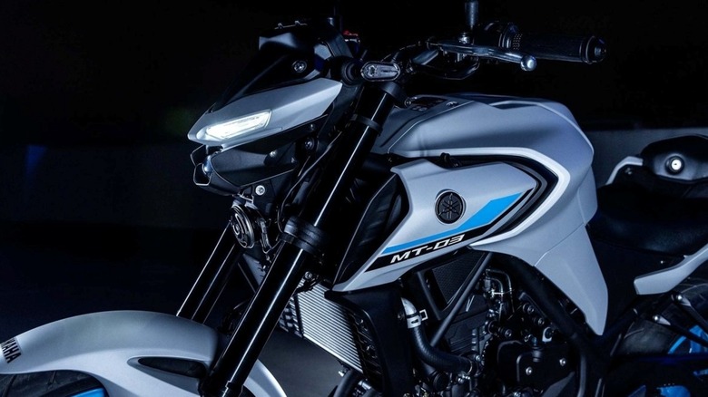 A closeup of the Yamaha MT-03 showing details of the headlight assembly.