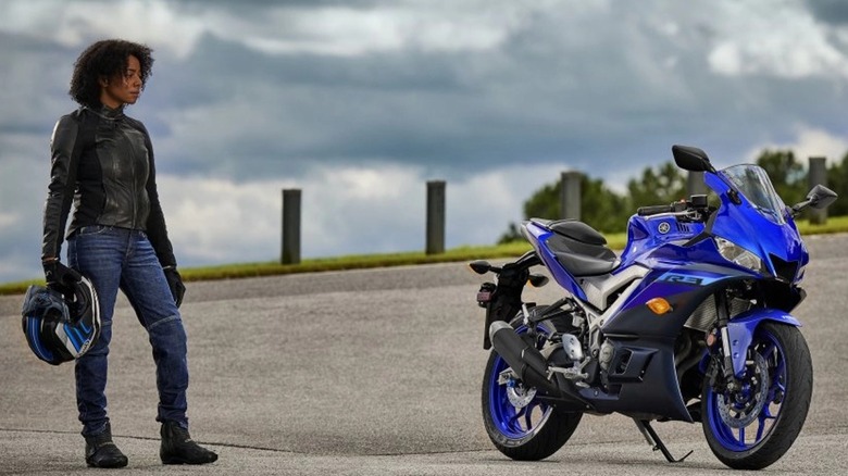 Rider looking at parked R3