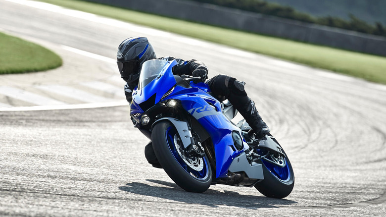 Person riding a Yamaha R6 on a racetrack