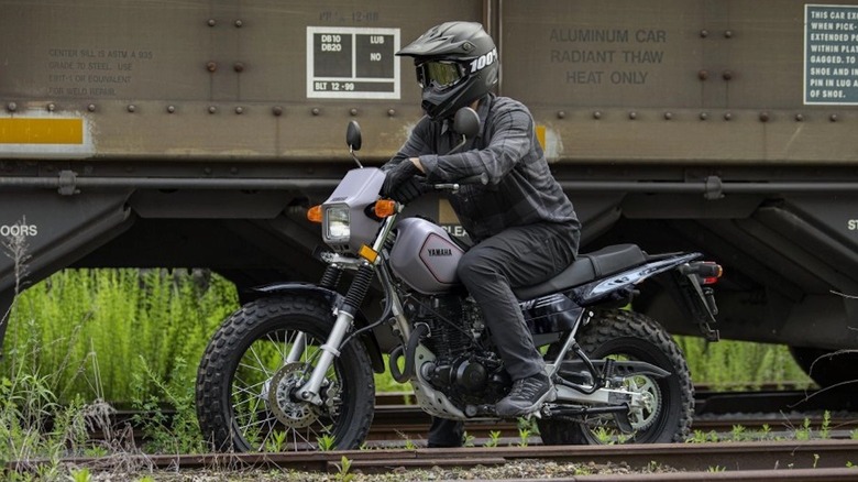 A person on a Yamaha TW200