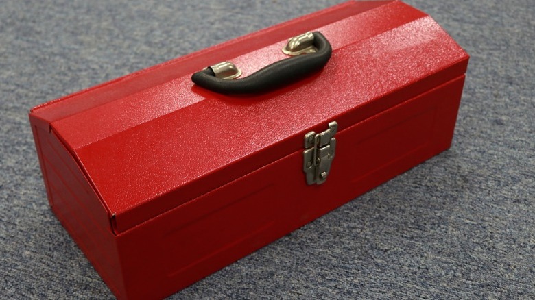 a traditional red metal tool box
