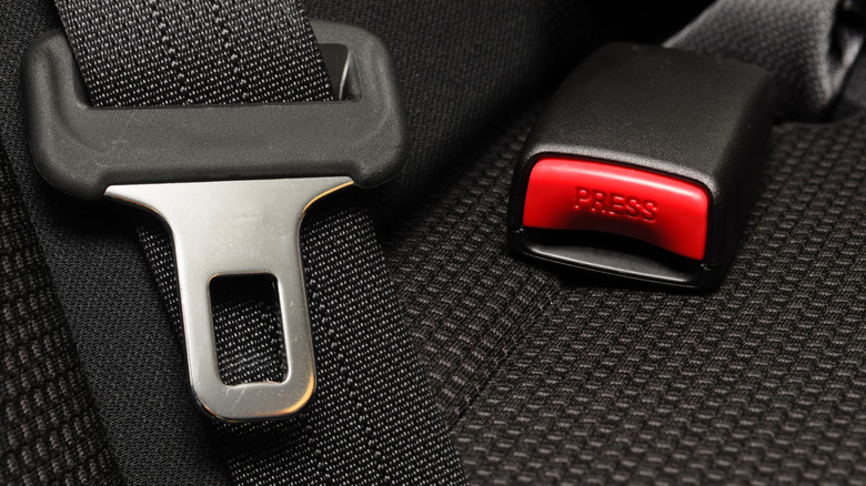 Close-up of a seatbelt inside a car