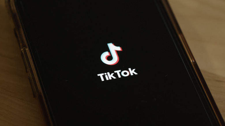 TikTok logo on phone screen