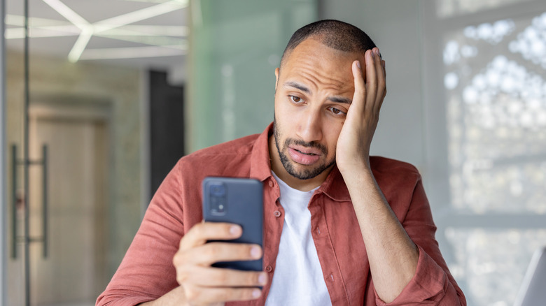 Man frustrated with phone