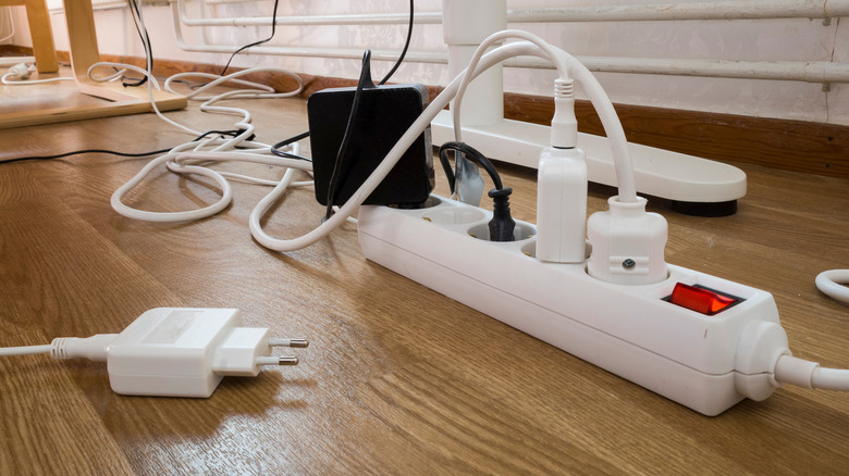 multiple chargers plugged into power strip