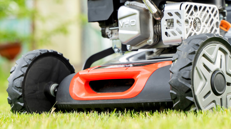 Front closeup of a lawn mower on grass