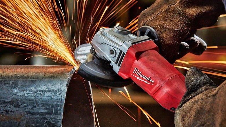 An image of a Milwaukee Grinder cutting pipe