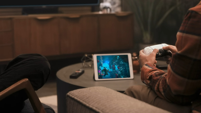 A person playing PS5 game on his tablet through PS Remote Play