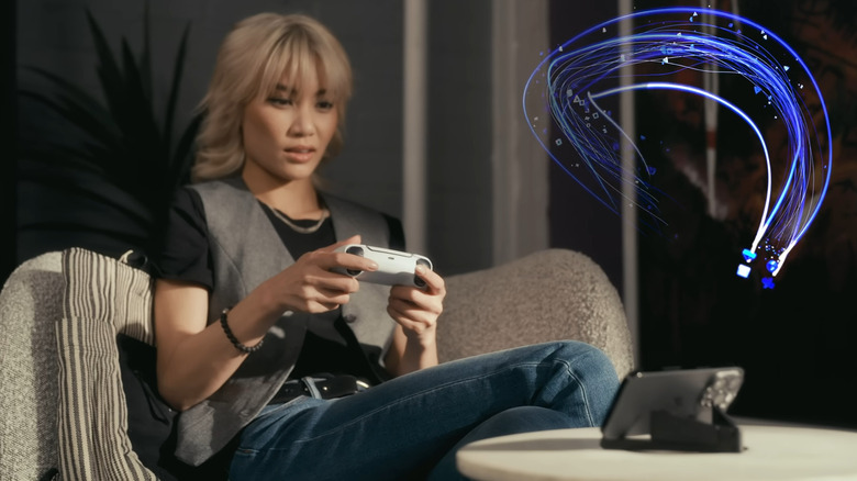 A person playing PS games on a smartphone through Remote Play.