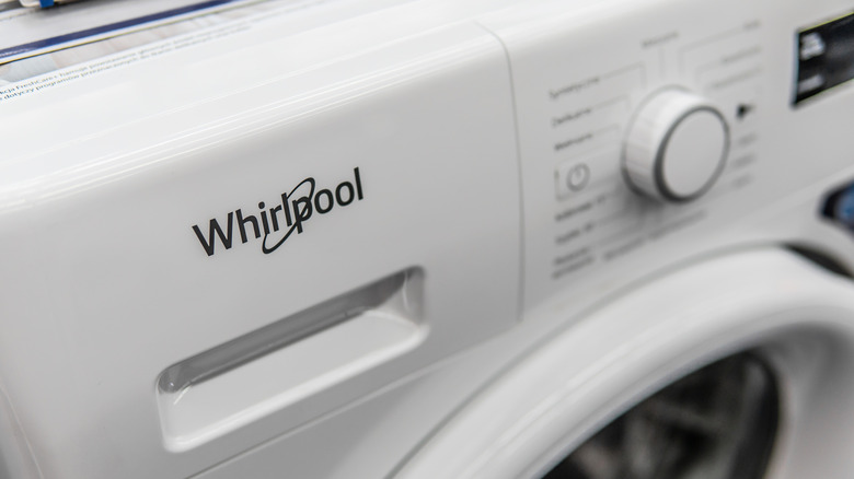 Close-up of the front panel of a Whirlpool front-loading washer