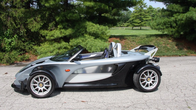 Silver and black Lotus 340R parked on road