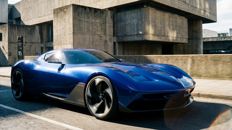 Rendering of front-engine Corvette concept driving in a futuristic urban setting