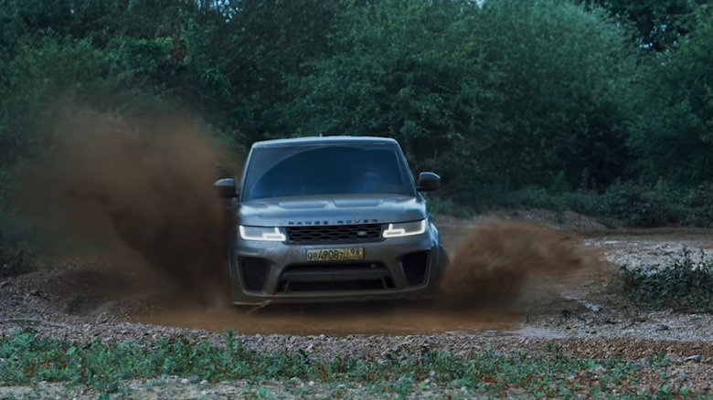 Range Rover Sport drifting through mud