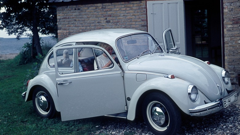 White 1960s beetle with its doors open