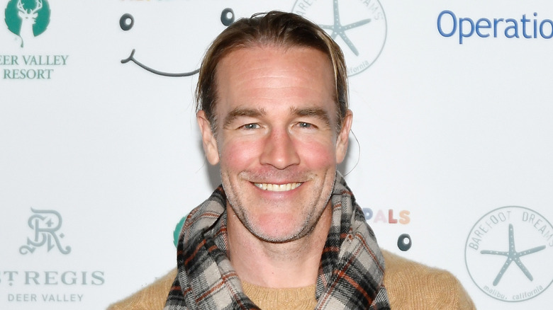 Portrait of James Van Der Beek smiling at an event.