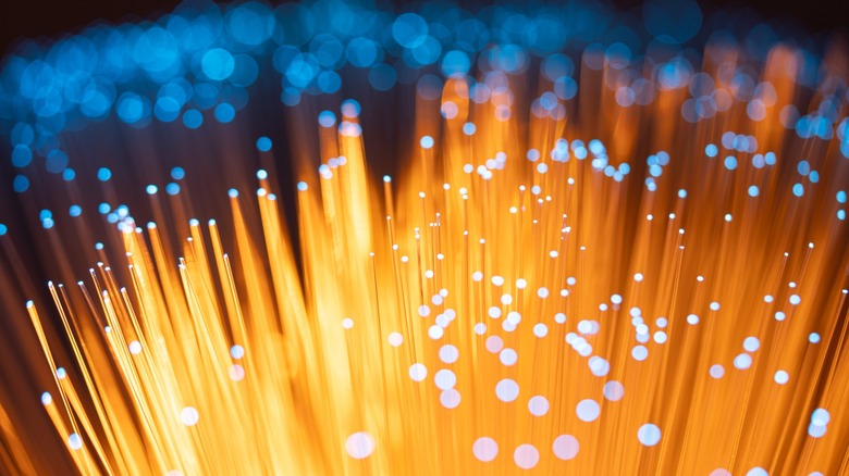 Micro shot of gold fiber strands in the thousands stretching out into the distance