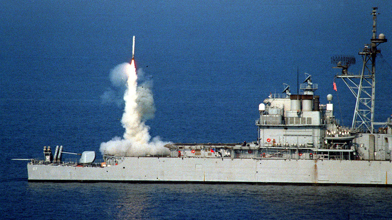 A Tomahawk cruise missile launches from the stern vertical launch system of the USS Shiloh