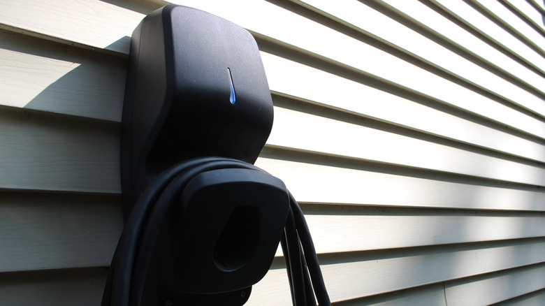 A Level 2 charger on the sidewall of a home