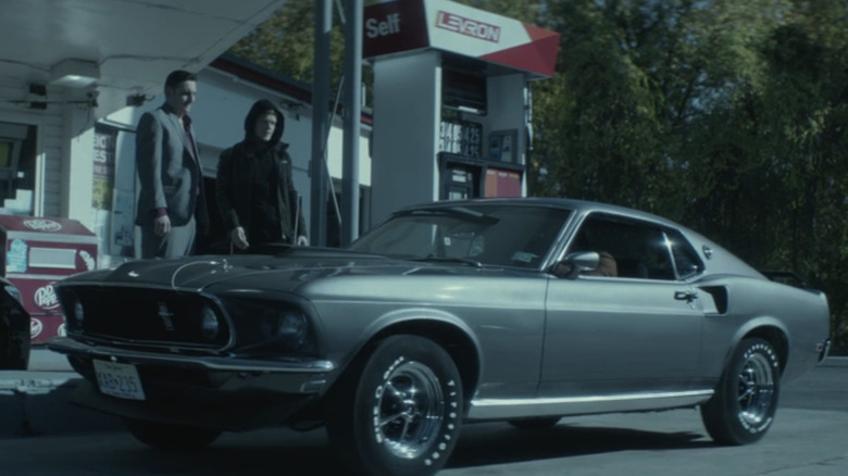 The 1969 Ford Mustang Mach 1 outside a gas station in "John Wick" scene